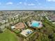 Aerial view of the neighborhood community pool, basketball court, playground, and surrounding residences at 11717 Navajo Sandstone St, Riverview, FL 33579