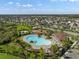 Overhead view of the community pool, playground, and well-maintained surrounding green spaces in a residential area at 11717 Navajo Sandstone St, Riverview, FL 33579