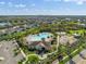 Aerial shot of the community clubhouse, pool area, playground, and neatly planned residential neighborhood at 11717 Navajo Sandstone St, Riverview, FL 33579