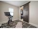 Exercise room with gym equipment, a sliding barn door, and a striped rug at 11717 Navajo Sandstone St, Riverview, FL 33579