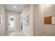 Light and bright foyer featuring tile flooring and front door with glass inserts at 11717 Navajo Sandstone St, Riverview, FL 33579