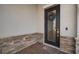 Close up of front door featuring brick facade and a decorative wreath at 11717 Navajo Sandstone St, Riverview, FL 33579