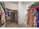 Spacious walk-in closet with shelving and hanging racks for clothing and shoes, offering ample storage space at 11717 Navajo Sandstone St, Riverview, FL 33579