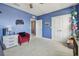 bedroom with vibrant blue walls and white trim at 12326 Dora Trl, Parrish, FL 34219