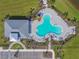 Overhead shot of the community pool and center featuring palm trees and various seating areas at 12326 Dora Trl, Parrish, FL 34219