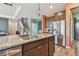 Kitchen with center island featuring granite countertop, stainless steel appliances and wood floors at 12326 Dora Trl, Parrish, FL 34219