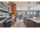 Kitchen featuring stainless steel appliances, wood cabinets and view to the living room at 12326 Dora Trl, Parrish, FL 34219