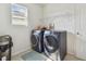 Laundry room featuring side-by-side washer and dryer at 12326 Dora Trl, Parrish, FL 34219