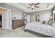 Spacious main bedroom with ceiling fan and natural light streaming in from multiple windows at 12326 Dora Trl, Parrish, FL 34219