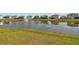 Community pond with a water feature, providing a peaceful view for surrounding homes at 12326 Dora Trl, Parrish, FL 34219