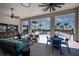 Beautiful clubhouse area with a poolside bar and comfortable lounge seating overlooking the stunning pool and palm trees at 12363 Hearts Ease St, Venice, FL 34293