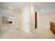 Bright hallway showcases a glimpse of the living room and staircase, offering an open and inviting transition at 1370 Pinellas Rd, Belleair, FL 33756