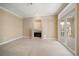 Inviting living room with a fireplace and sliding glass doors to the outside at 1370 Pinellas Rd, Belleair, FL 33756