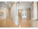 Elegant living room featuring columns, chandelier and French doors leading to the outside at 1370 Pinellas Rd, Belleair, FL 33756