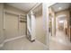 Spacious walk-in closet with custom shelving and storage solutions at 1370 Pinellas Rd, Belleair, FL 33756