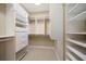 Well-organized walk-in closet with shelves, drawers, and ample storage space at 1370 Pinellas Rd, Belleair, FL 33756