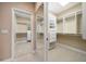 Walk-in closet with custom storage solutions and a mirrored door at 1370 Pinellas Rd, Belleair, FL 33756