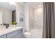 This bathroom features a shower and tub combination with stylish tile and a modern vanity at 13727 Evergreen Valley Dr, Riverview, FL 33578