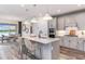 Stylish kitchen island with pendant lighting and stainless steel appliances at 13727 Evergreen Valley Dr, Riverview, FL 33578