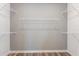 Walk-in closet with shelving ready to be organized at 13727 Evergreen Valley Dr, Riverview, FL 33578