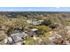 A serene aerial view of the neighborhood with mature trees and glimpses of backyard pools at 13815 Capitol Dr, Tampa, FL 33613