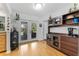 Dining area with bamboo floors, built-in hutch, and sliding glass doors to the outdoor space at 13815 Capitol Dr, Tampa, FL 33613