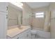 Bathroom showcasing a vanity, mirror, bath tub, and a shower at 14350 Hill Country Rd, Brooksville, FL 34614