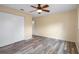 Bedroom features wood-look floors, closet, and natural light at 14350 Hill Country Rd, Brooksville, FL 34614