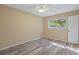 Bedroom featuring a window letting in natural light and wood-look floors at 14350 Hill Country Rd, Brooksville, FL 34614