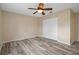 Bedroom featuring light wood flooring, cream walls, and a closet at 14350 Hill Country Rd, Brooksville, FL 34614