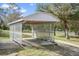 Carport with wood structure providing covered parking at 14350 Hill Country Rd, Brooksville, FL 34614