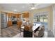 Cozy kitchen with stainless steel appliances, wood cabinets and breakfast table at 14350 Hill Country Rd, Brooksville, FL 34614