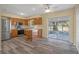 Cozy kitchen with stainless steel appliances, wood cabinets and island at 14350 Hill Country Rd, Brooksville, FL 34614