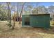 Storage shed with window and double door at 14350 Hill Country Rd, Brooksville, FL 34614