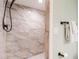 A well-lit marble tiled shower complements this bathroom at 14700 Seminole Trl, Seminole, FL 33776