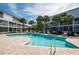 Inviting community pool area with lounge chairs and palm trees at 14700 Seminole Trl, Seminole, FL 33776