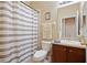 Cozy bathroom with shower and tub combination, vanity and neutral color palette at 1604 Harvest Grove Ct, Valrico, FL 33596