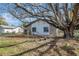 Charming home featuring stone accents, complemented by mature trees and a well-maintained front yard at 16106 Blackbeard Ln, Hudson, FL 34667