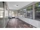 Enclosed sunroom featuring wood floors, offering a relaxing space at 16106 Blackbeard Ln, Hudson, FL 34667