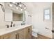 Modern bathroom features double sinks, decorative mirror, and stylish wood-look vanity at 1624 Barry Rd, Clearwater, FL 33756