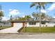 Charming single-story home featuring a well-manicured lawn and a driveway at 1624 Barry Rd, Clearwater, FL 33756