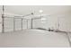 Spacious two car garage with white walls and epoxy flooring at 1624 Barry Rd, Clearwater, FL 33756