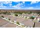 Aerial view of a neighborhood showcasing well-maintained homes with lush greenery and mature trees at 19131 Weymouth Dr, Land O Lakes, FL 34638