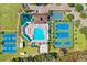 Beautiful aerial view of community pool, tennis courts, basketball courts, and clubhouse at 19131 Weymouth Dr, Land O Lakes, FL 34638