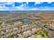 Aerial view of community with lakes, landscaping and beautiful homes at 19131 Weymouth Dr, Land O Lakes, FL 34638