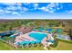 Aerial view of the community pool, sundeck, clubhouse and cabanas at 19131 Weymouth Dr, Land O Lakes, FL 34638