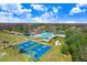 Aerial view of community basketball courts, pool, clubhouse, and other amenities at 19131 Weymouth Dr, Land O Lakes, FL 34638