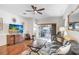 Cozy living room with plenty of natural light and a sliding door to the outside patio at 19131 Weymouth Dr, Land O Lakes, FL 34638