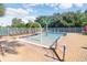 Community kiddie pool with water features, tables and lounge chairs at 19131 Weymouth Dr, Land O Lakes, FL 34638