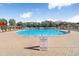 Large community pool with ample seating and clear signage for safety at 19131 Weymouth Dr, Land O Lakes, FL 34638